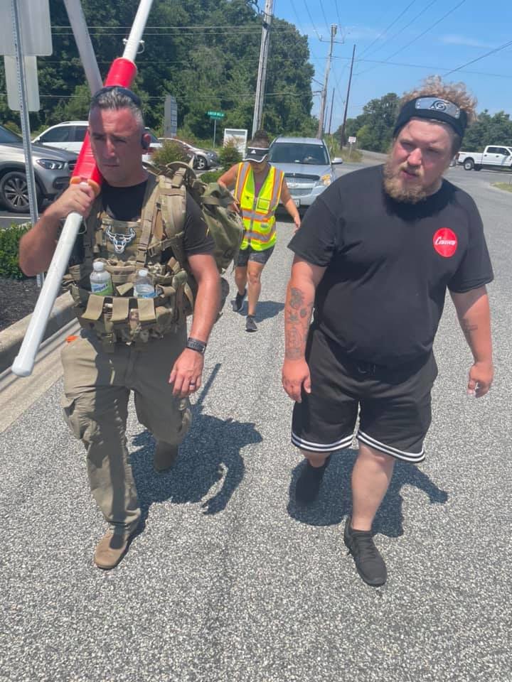 At left Jacob Day, mayor of Salisbury, Md., helps carry the cross on the last day of the Hope100. Day also serves as a Major in the Maryland National Guard.   This photo is being used for non-commercial purpose and not in connection with selling a good or service.